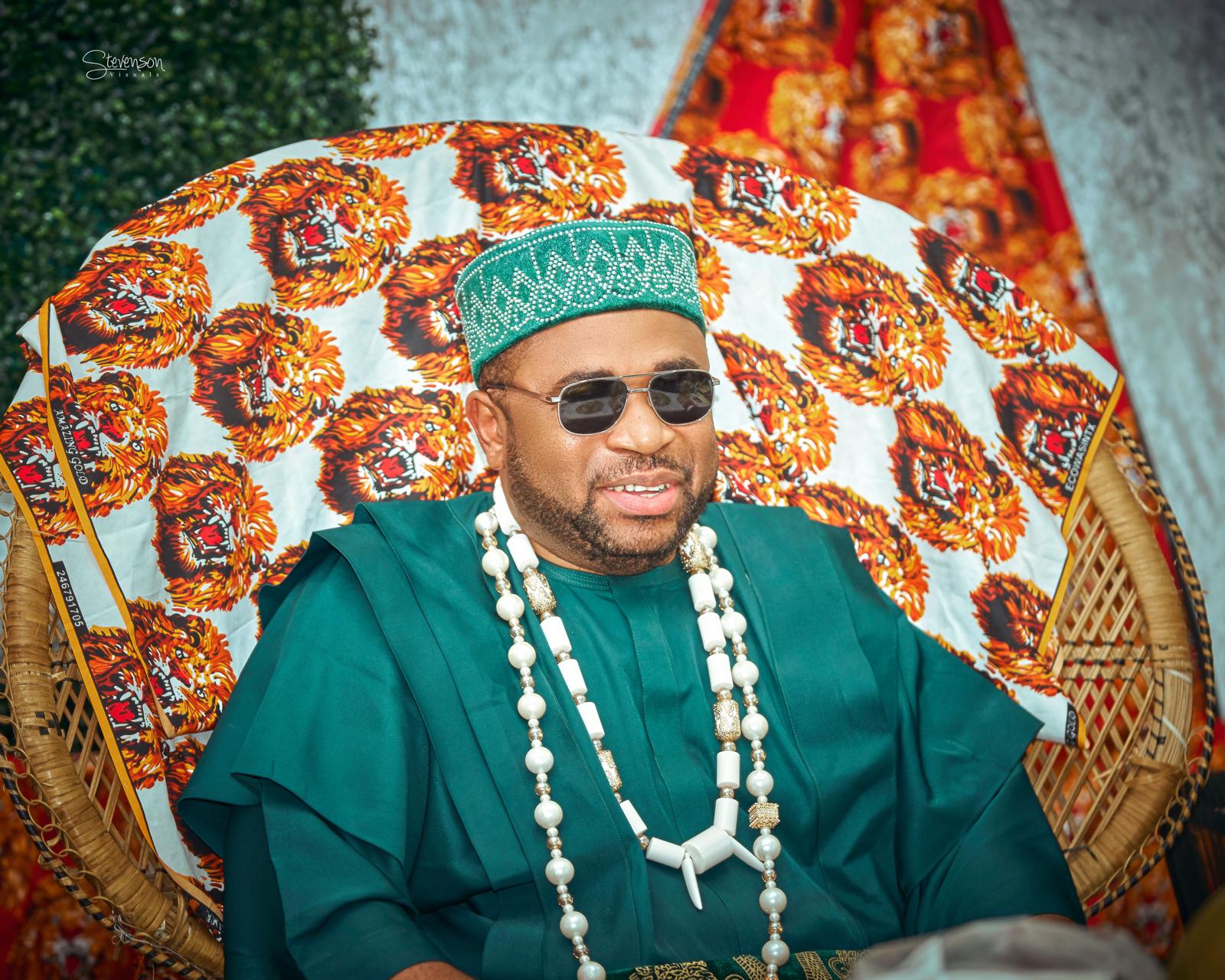 Igwe Dr. Amanze N. Ikwu seated in traditional attire